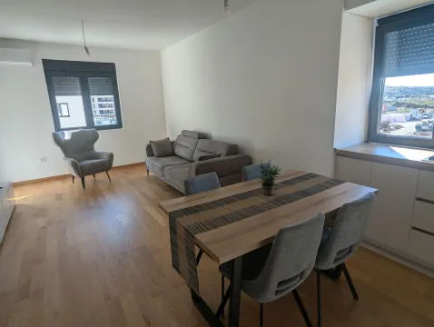Living room with a dining area and seating furniture. - image 15