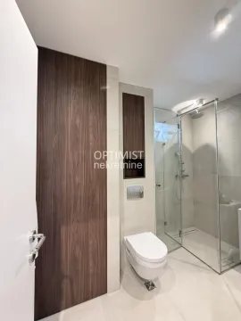 Modernly equipped bathroom with a walk-in shower and built-in sanitaryware. - image 17