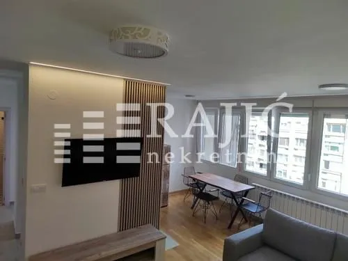 Living room with dining area and modern furniture.