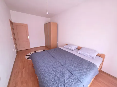 Bedroom with a double bed and a wardrobe. - image 6