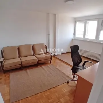 Living room with a sofa set and a desk. - image 4