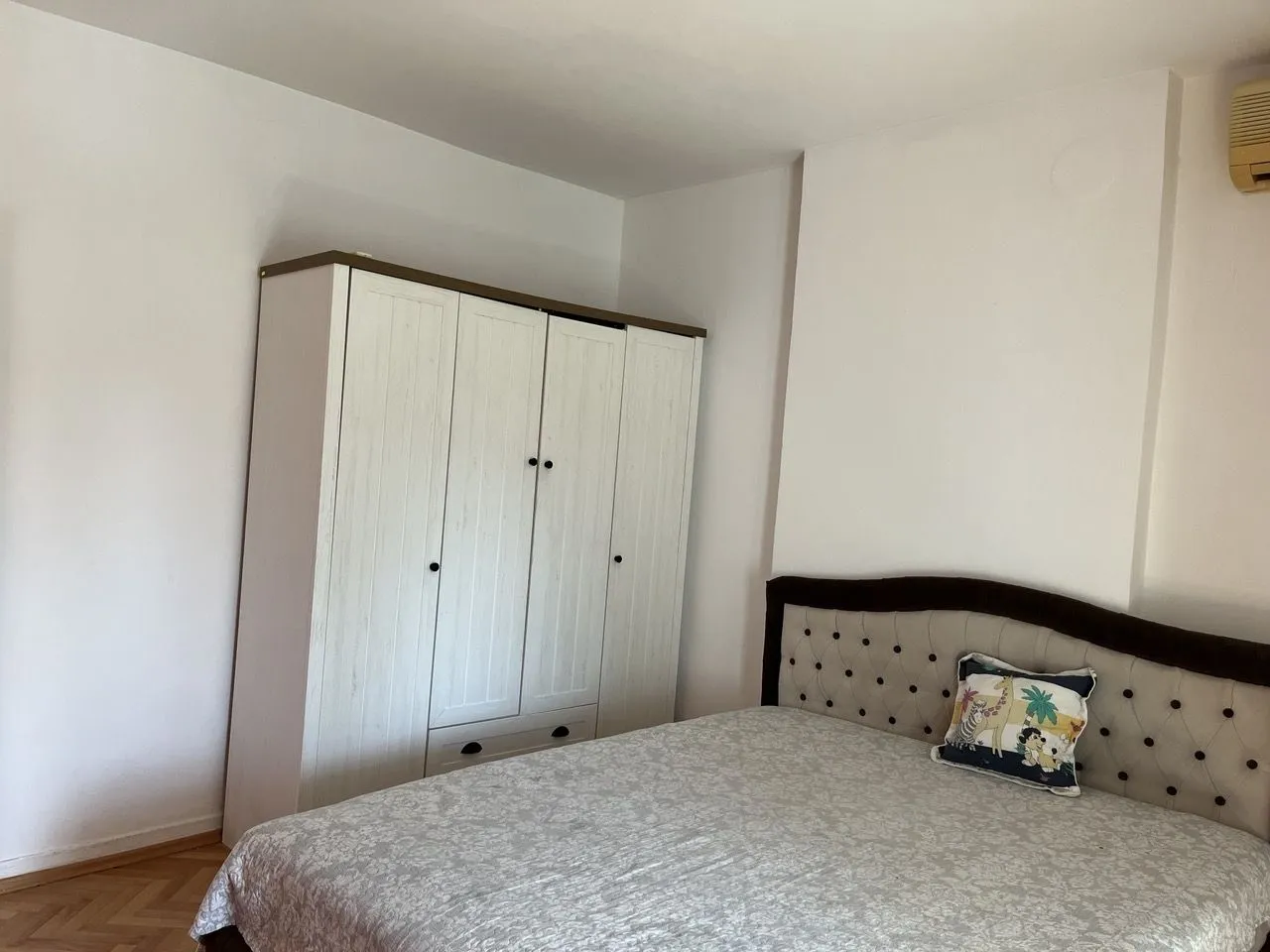 Bright bedroom with a wardrobe.