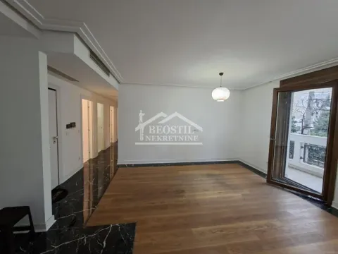Empty living room with hardwood floors and access to the terrace. - image 4