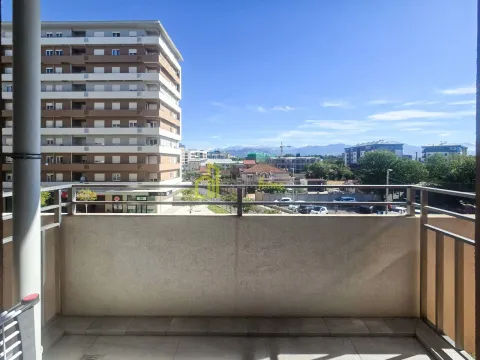 View from the balcony overlooking surrounding buildings and the cityscape. - image 14