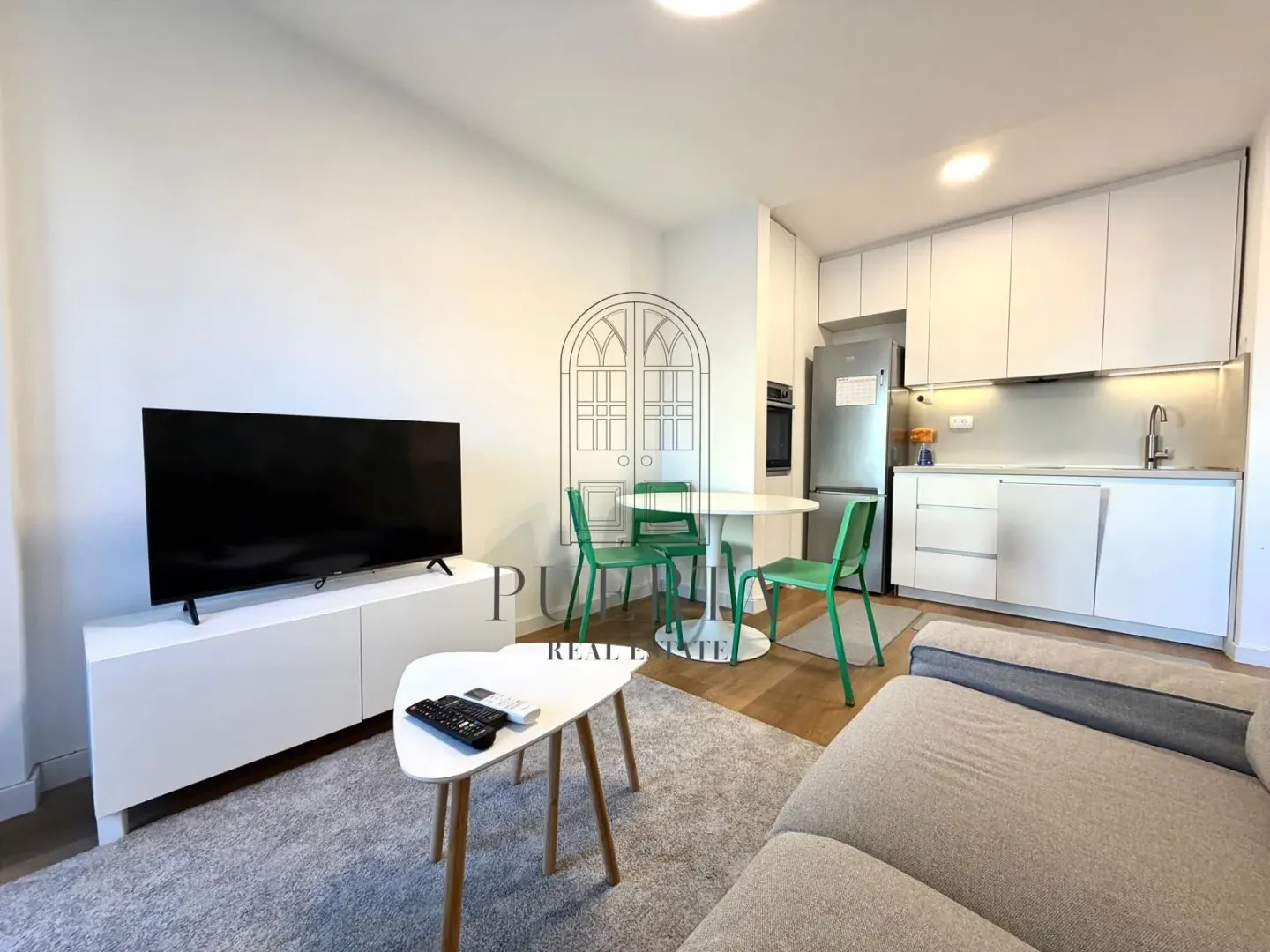 Living room with kitchen and dining area.