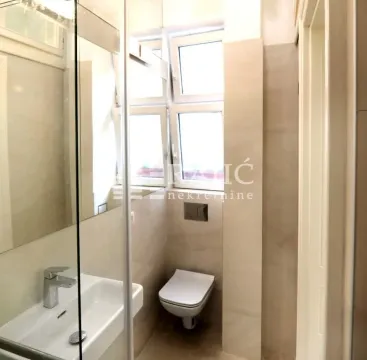 Smaller bathroom with a sink and toilet bowl. - image 8