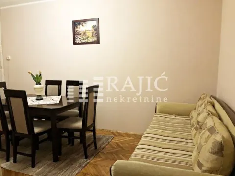 Living room with a sofa set and a dining table. - image 6
