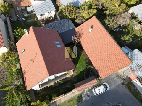 Aerial view of the houses with a courtyard and red tile roofs. - image 3