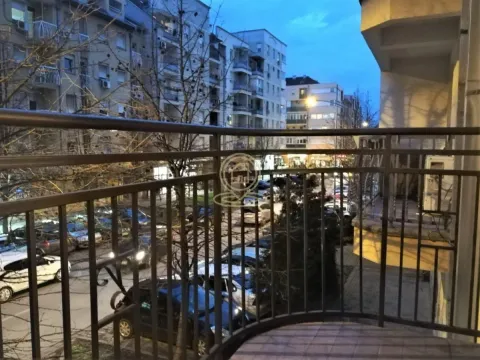 View from the balcony overlooking the city street and buildings. - image 7