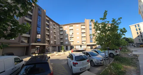View of the exterior of the residential building and the courtyard with parking. - image 3
