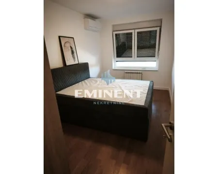 Bedroom with a double bed and a window. - image 11
