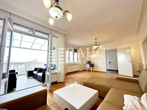 Spacious living room with furniture and terrace access. - image 3