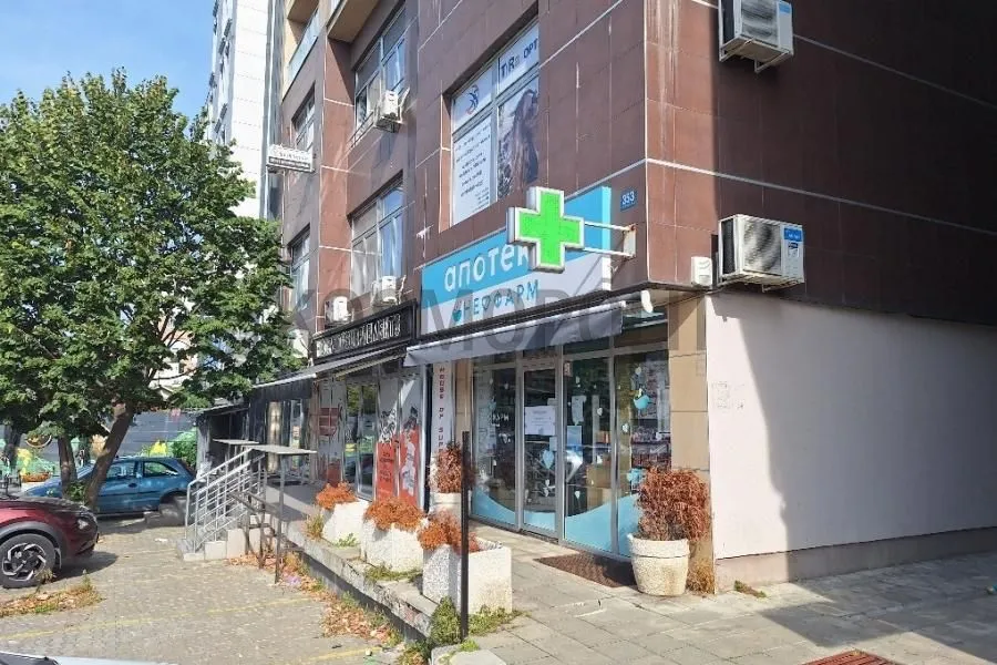Exterior view of the building with commercial space on the ground floor.