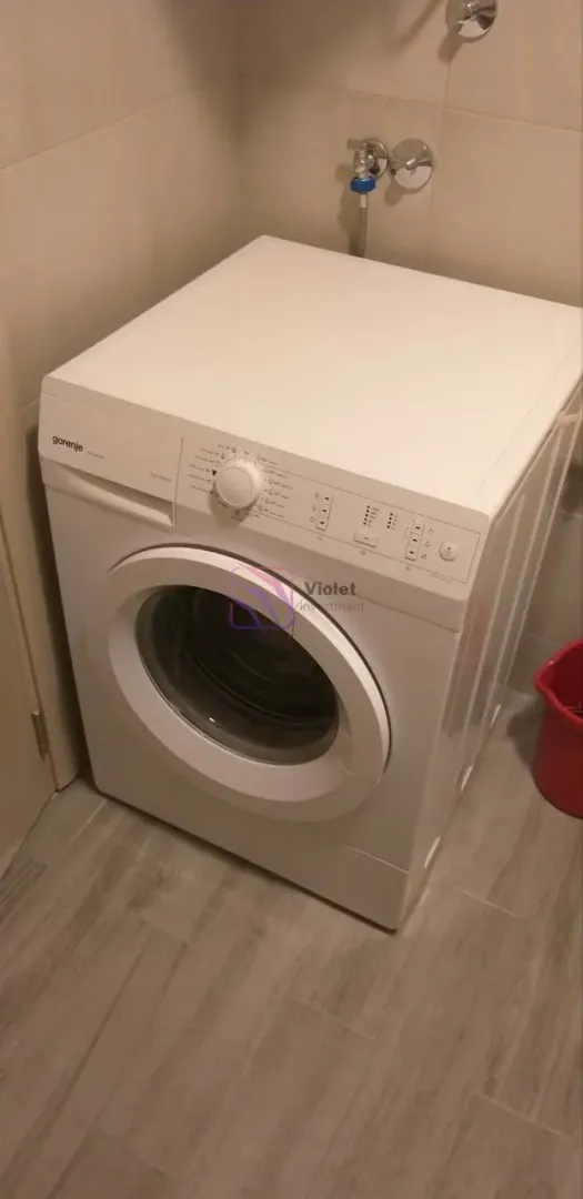 White washing machine in the bathroom.
