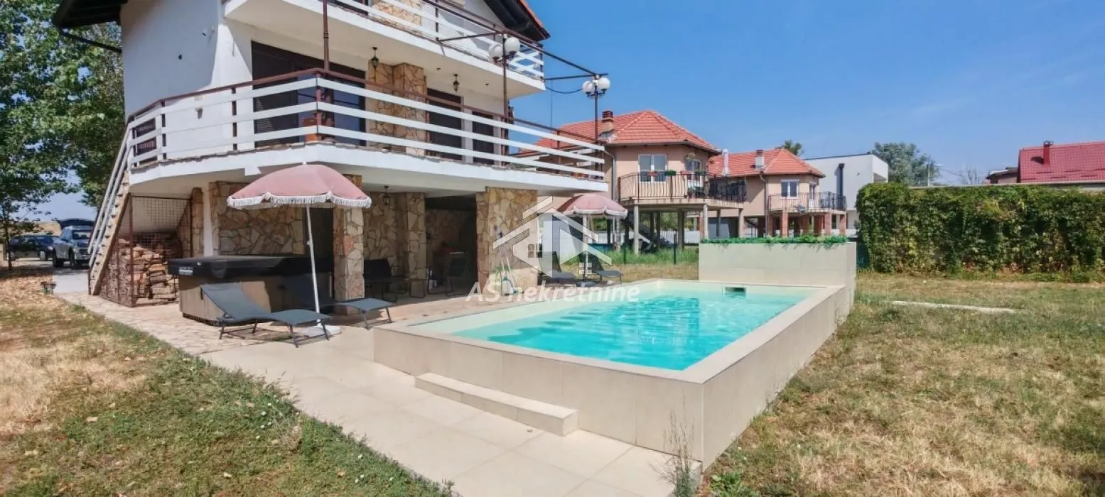View of the house yard with a swimming pool and terrace.
