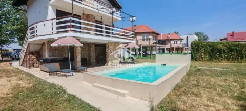 View of the house yard with a swimming pool and terrace. - image 37