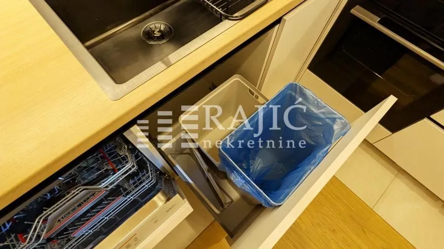 View of kitchen units with an integrated sink and dishwasher.
