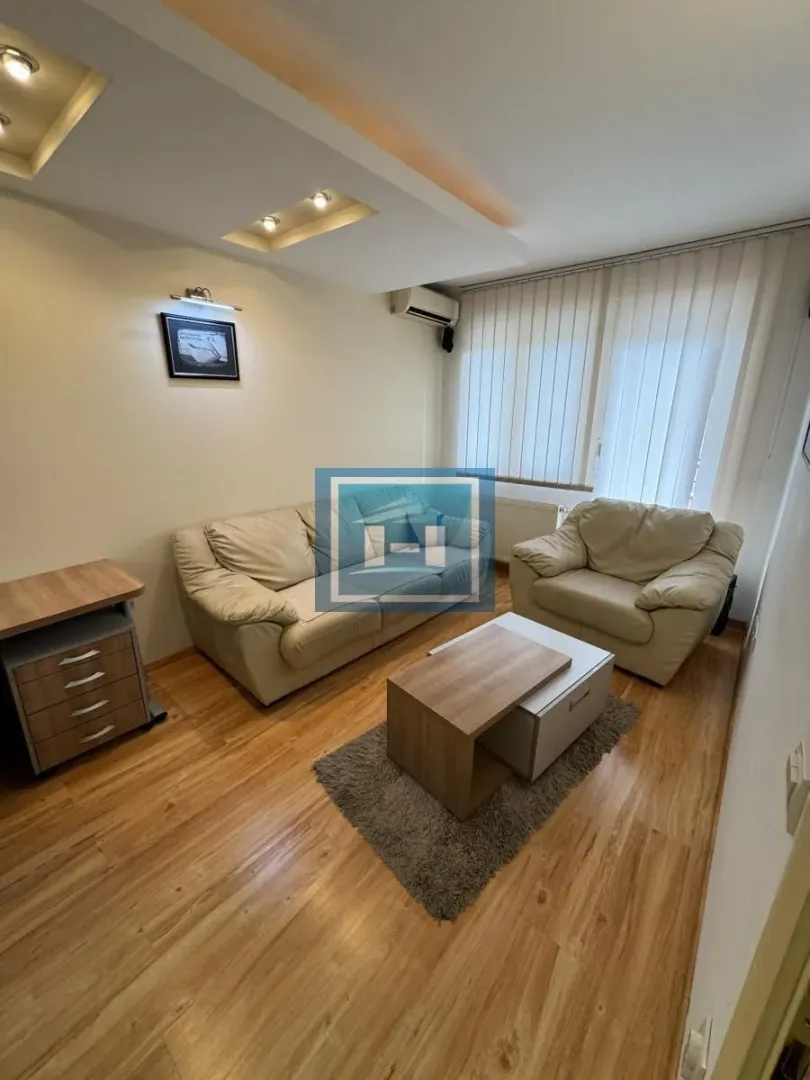 Living room with sofa seating and a coffee table.