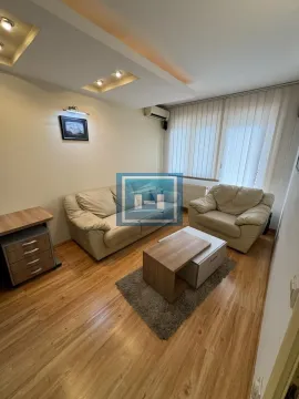 Living room with sofa seating and a coffee table. - image 6