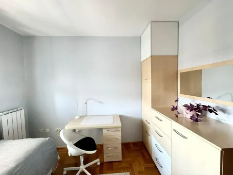 Small room with a desk, wardrobe, and chest of drawers. - image 17