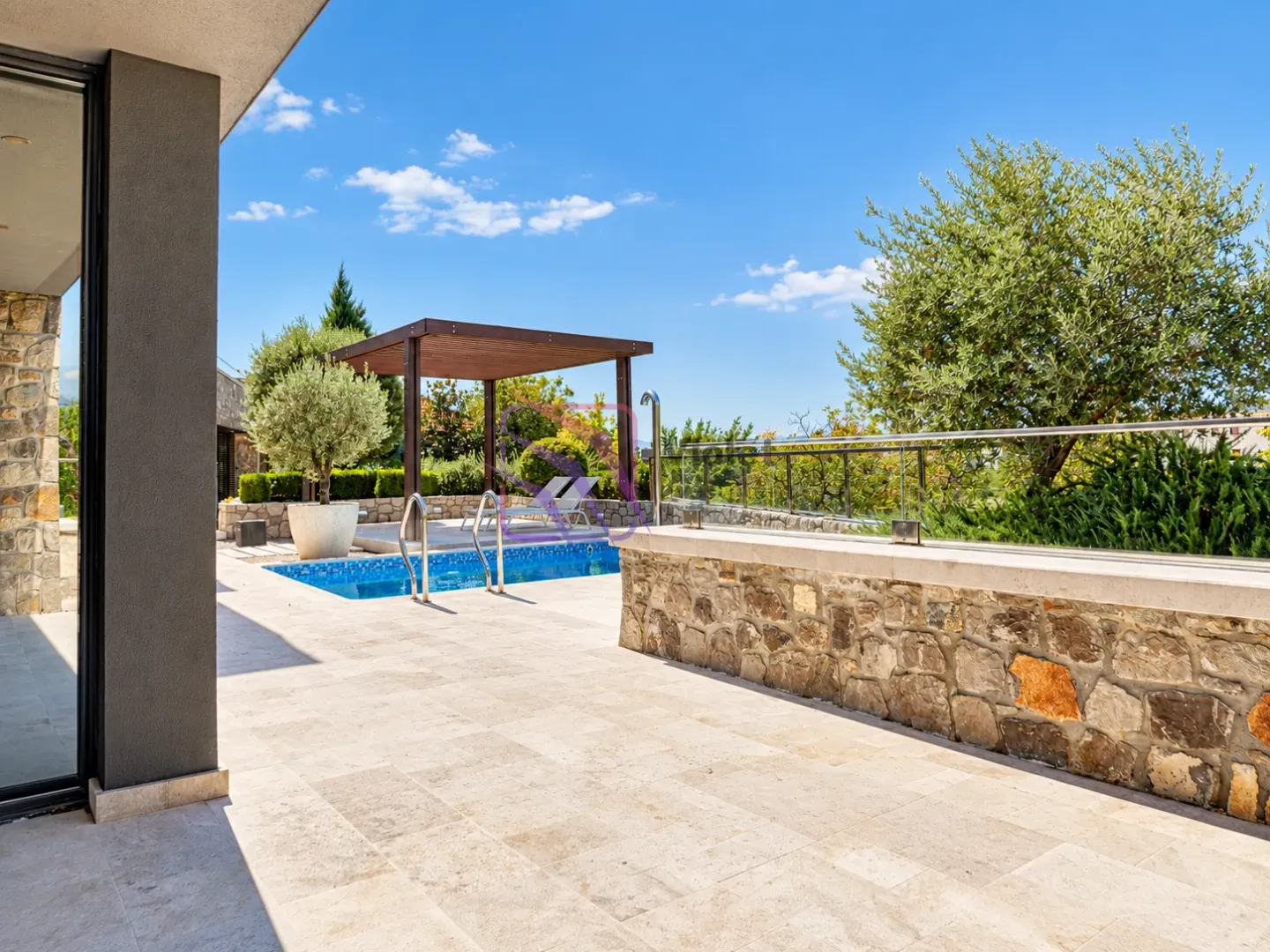 Yard with a swimming pool, paved terrace and sunshade.