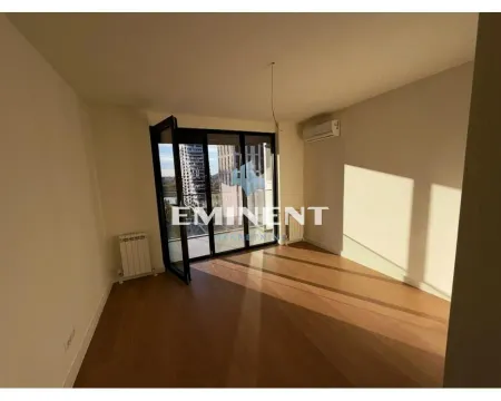Empty room with wooden flooring and access to the terrace. - image 13