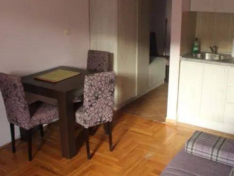 Living room with a dining area and an open-plan kitchen. - image 7