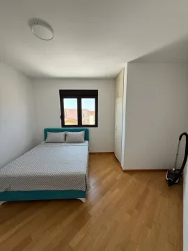 Smaller bedroom with a double bed, wardrobe, and window. - image 4