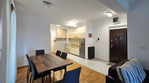 Living room with dining area and kitchen in the background. - image 6