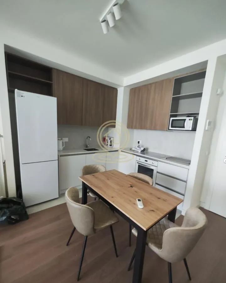Kitchen with a dining table and chairs.