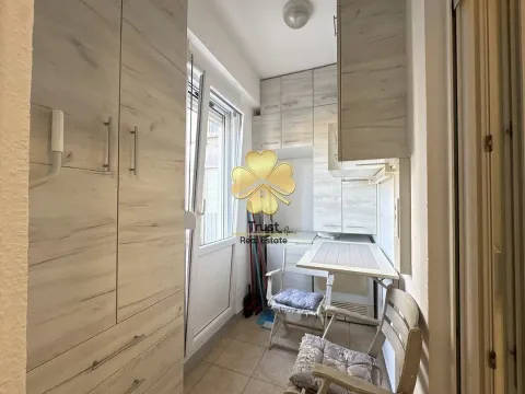 Smaller kitchen with built-in units and a dining table. - image 4