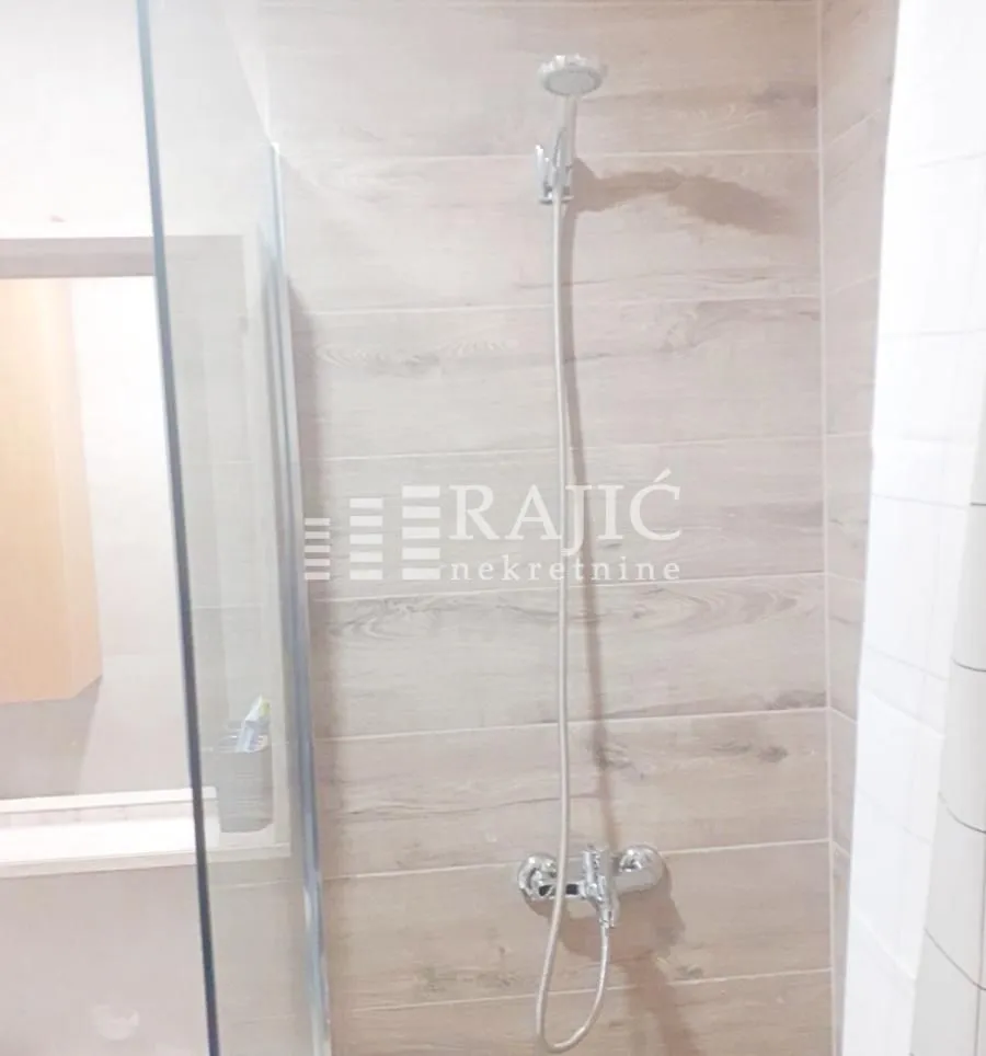 View of the shower cabin in a modern bathroom.