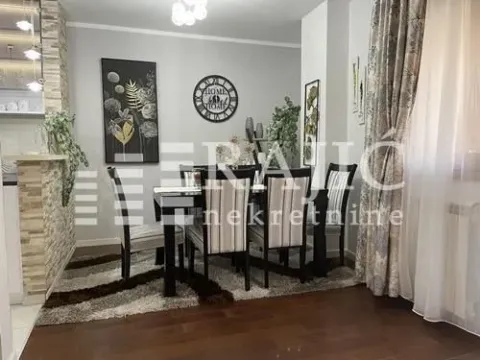 Living room with dining area, seating set, and decorative details. - image 4