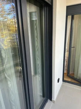 Balcony doors with dark frames. - image 10