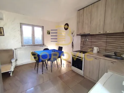 Kitchen with a dining table and chairs. - image 2