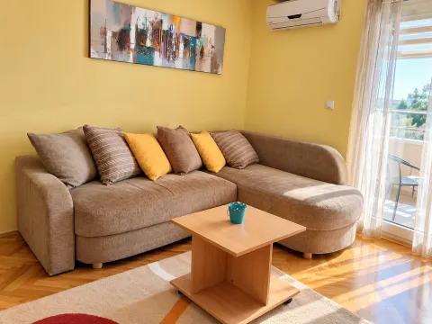 Living room with a sofa, coffee table, and access to the terrace. - image 2