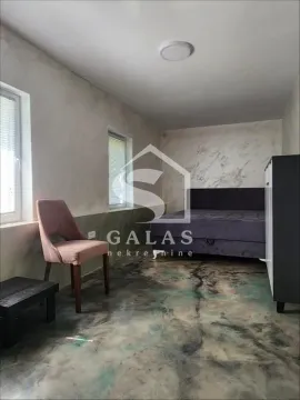 Bedroom with a double bed, a chair and a decorative floor. - image 15