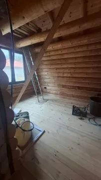 Attic under construction with wooden walls and flooring. - image 17