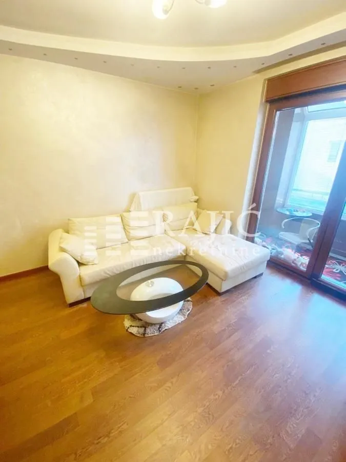 Living room with sofa and coffee table.