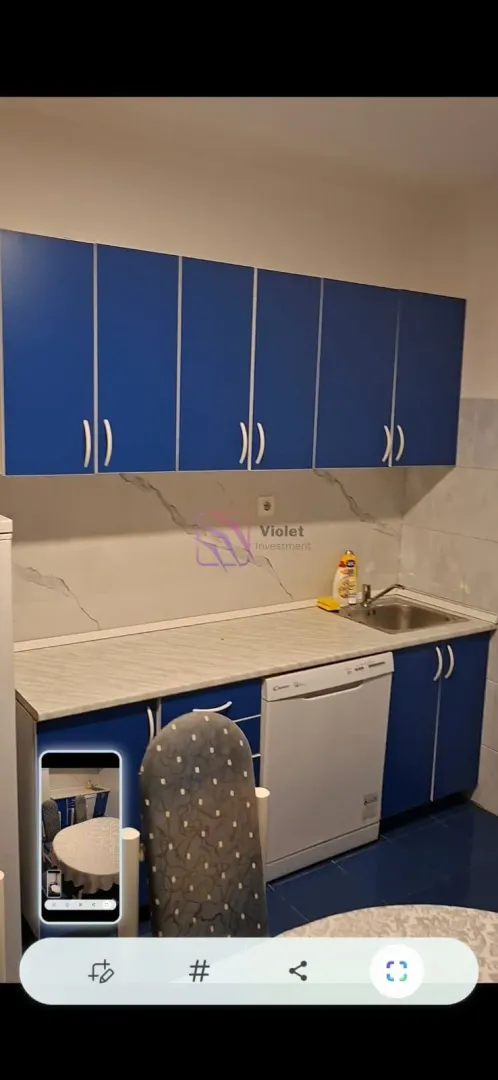 Kitchen with blue cabinets and a sink.