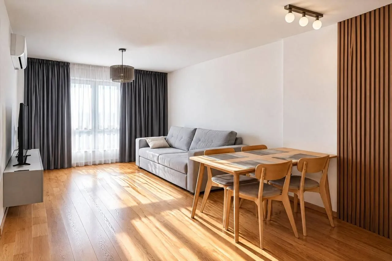 Living room with a sofa and dining table.
