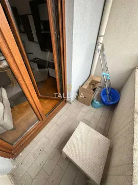 Smaller balcony with ceramic tiles and wooden balcony doors. - image 15
