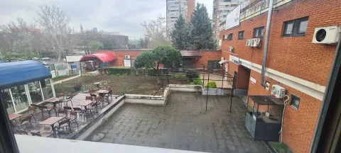 View from the window of the outdoor area and surrounding buildings. - image 10