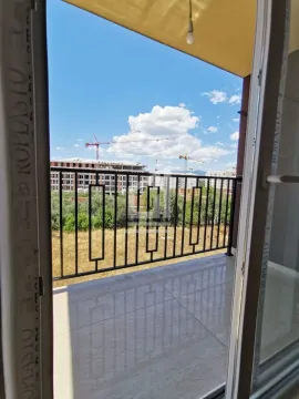 View from a tiled balcony terrace with a metal railing. - image 5