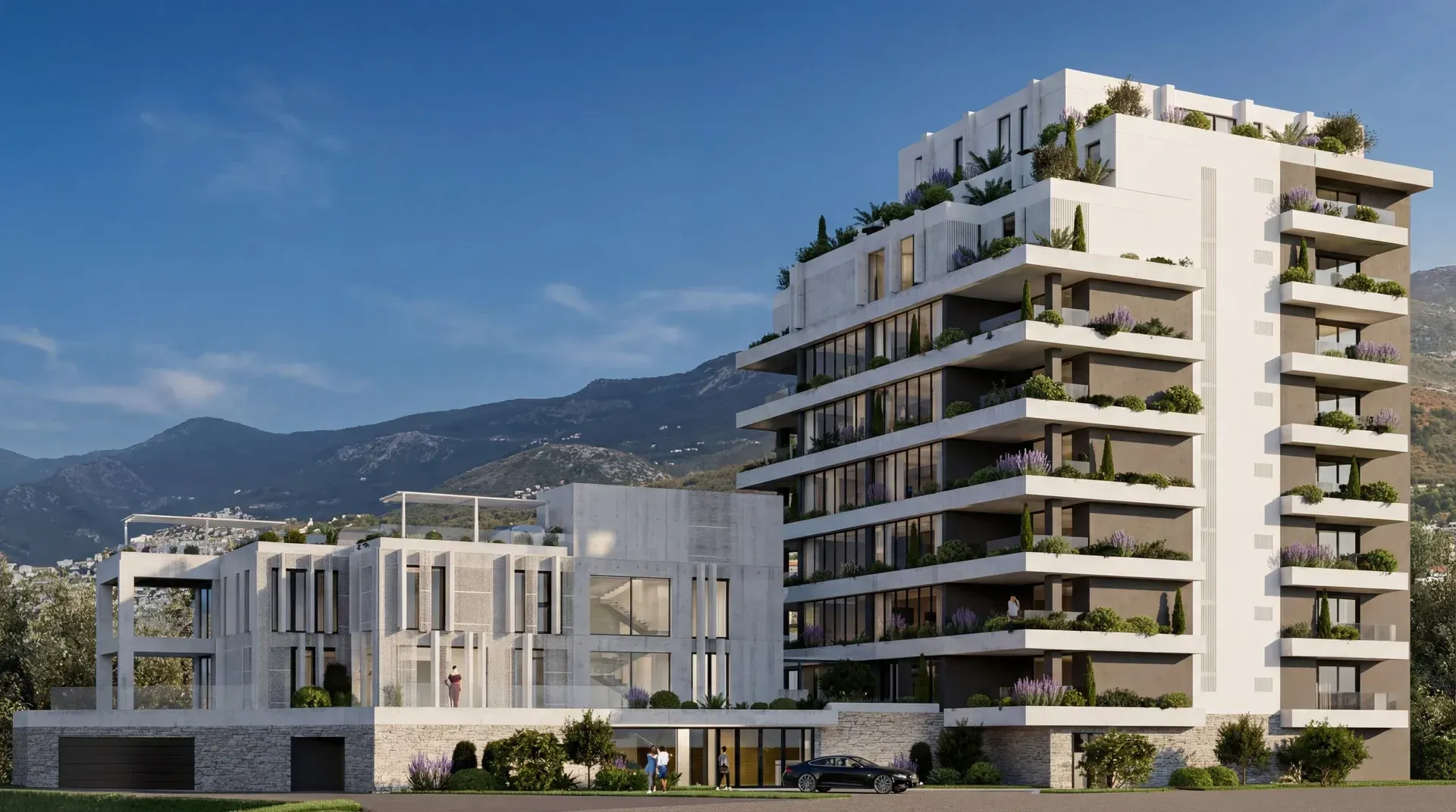 Exterior view of a modern residential building with terraces and surrounding greenery.