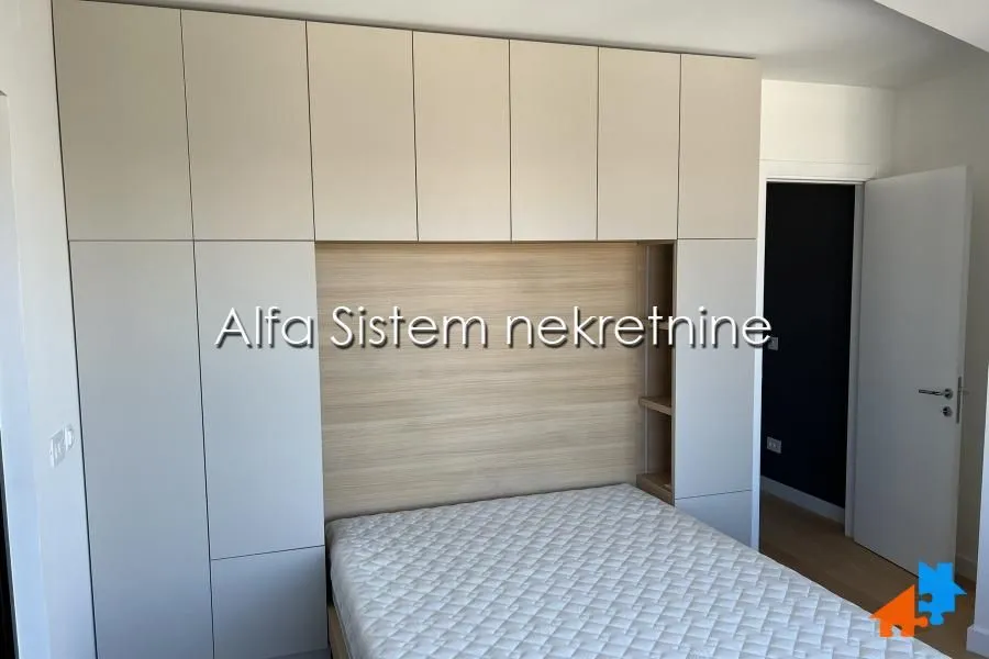 Bedroom with built-in wardrobes and a bed.