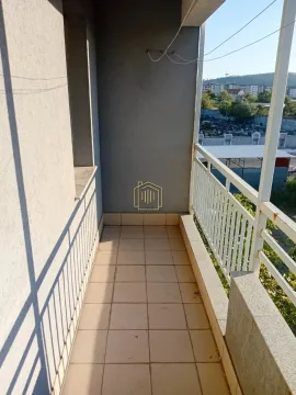 Empty balcony with ceramic tiles and a railing. - image 8