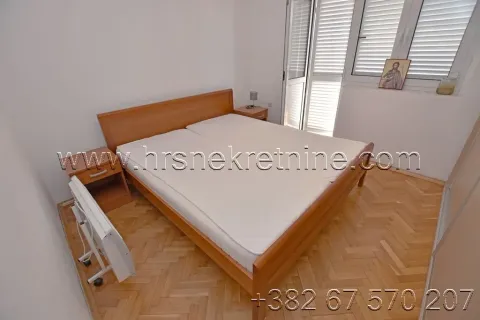 Bedroom with a double bed and parquet flooring. - image 15