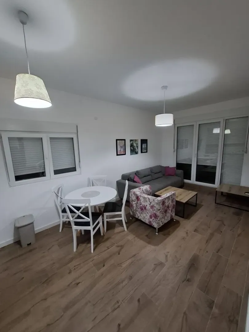 Spacious living room with a dining area and seating set.