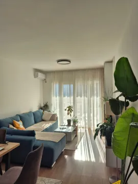 Living room with a sofa and access to the terrace. - image 16